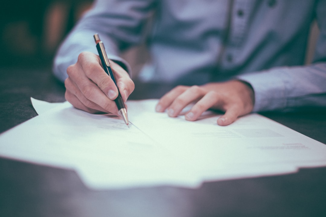 A notary public viewing the document before stamping